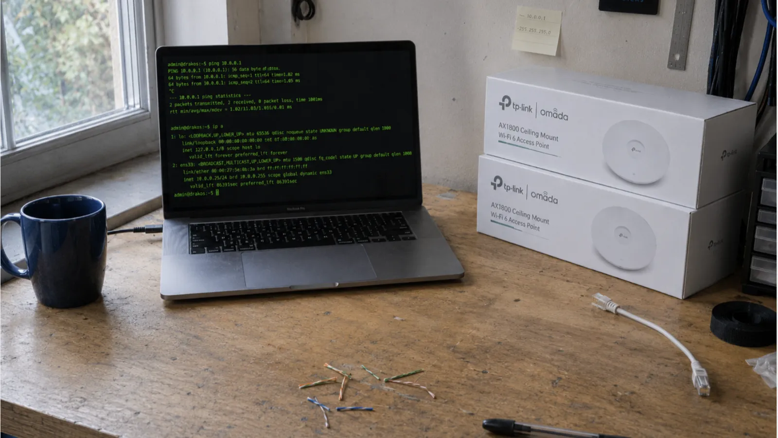 About Drakos Systems - workbench with laptop and cable tester