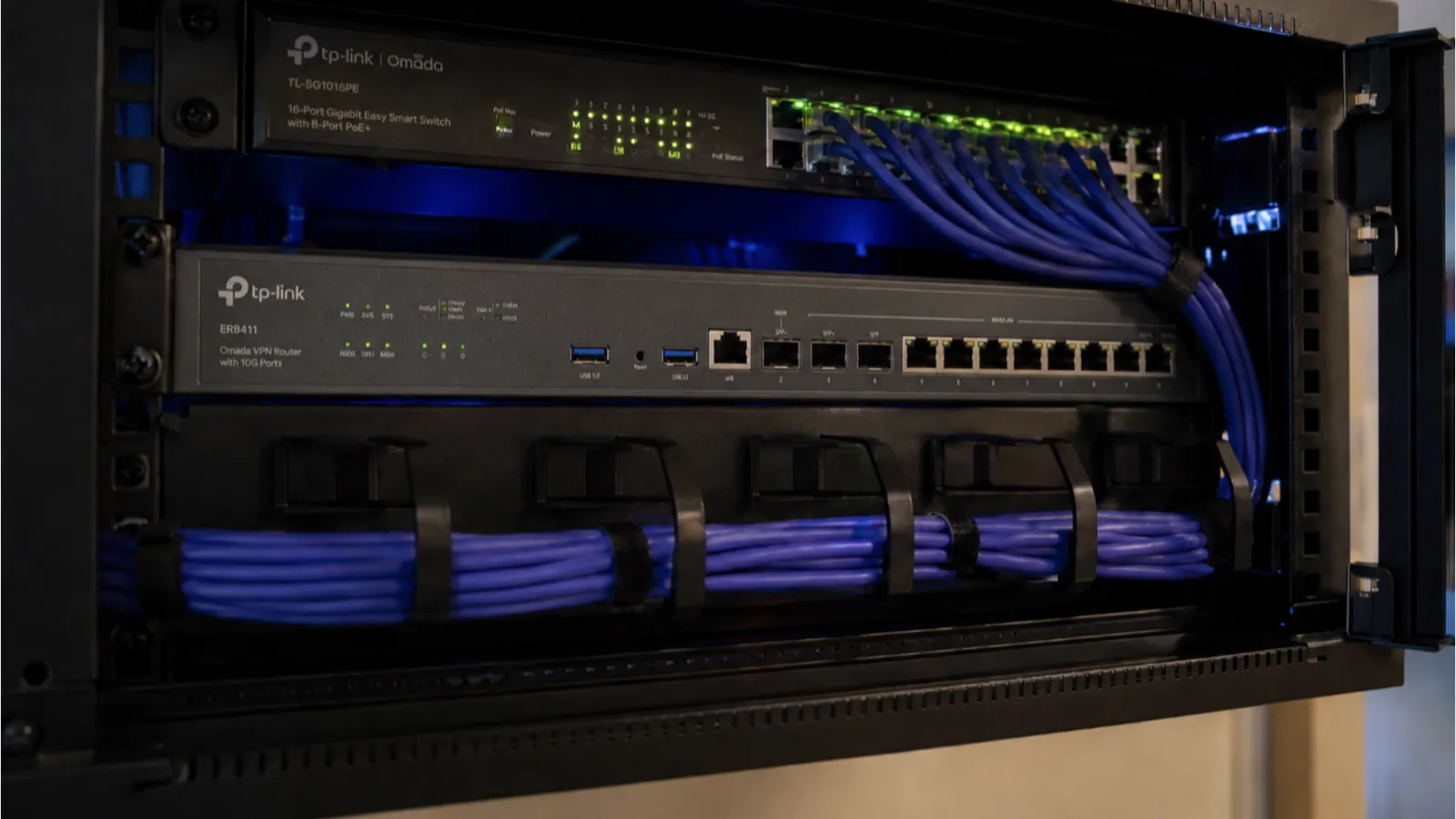 Managed firewall - router in network cabinet with blue LEDs