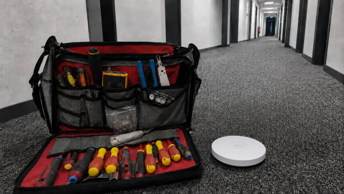 White-label IT installation - onsite engineer deploying network equipment in Northern Ireland